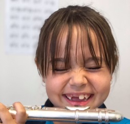 Photo of Student playing flute.